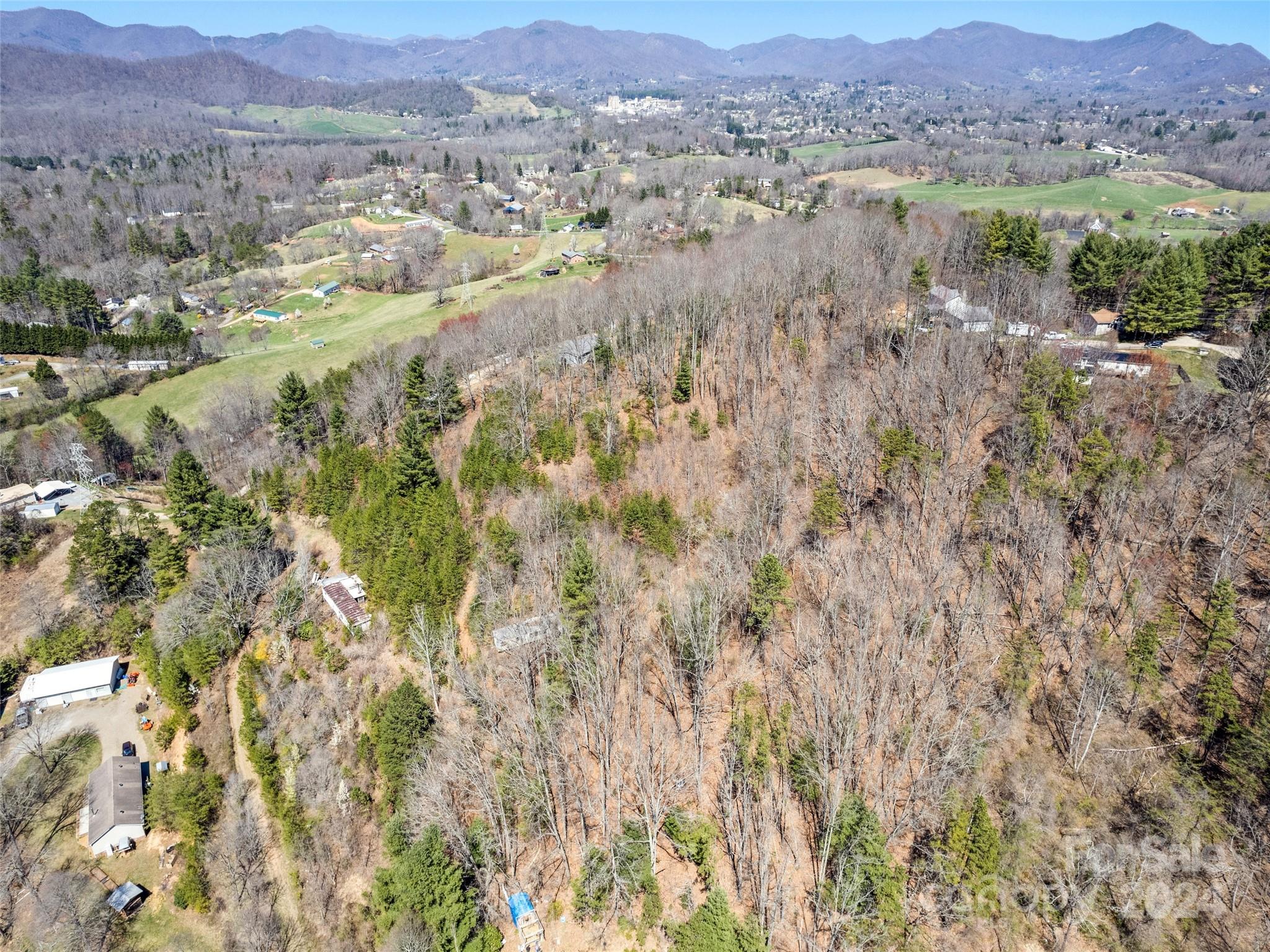 269 Turtle Springs Road, Unit LOT 10A Canton, NC 28716 - Photo 5 of 12 a view of a lush green hillside and houses