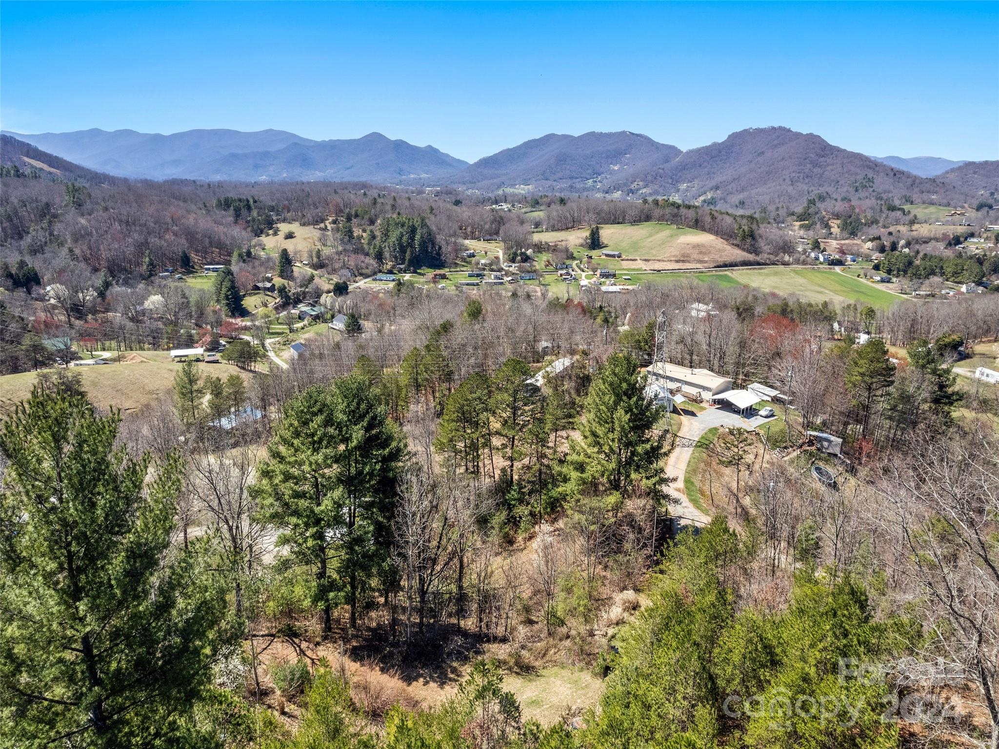 269 Turtle Springs Road, Unit LOT 10A Canton, NC 28716 - Photo 9 of 12 a view of a lush green hillside and houses