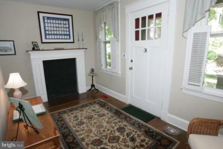 625 Deepdene Road Baltimore, MD 21210 - Photo 8 of 20 a living room with furniture and a fireplace