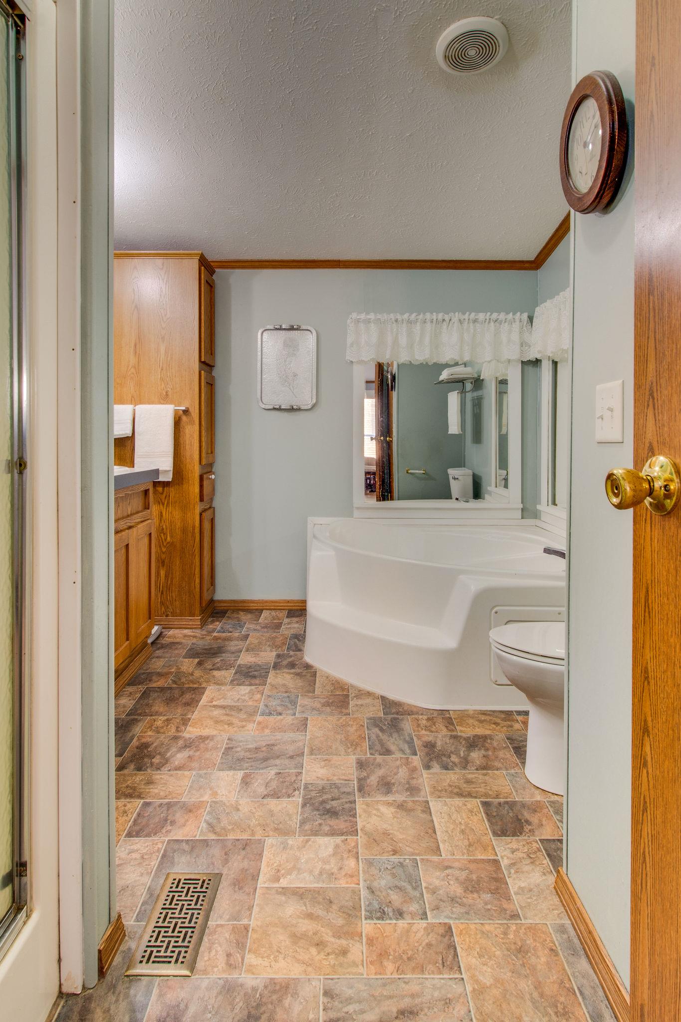 3957 Akin Ridge Road Williamsport, TN 38487 - Photo 19 of 28 Master Bath has double vanity, separate shower and tub, linen closet and additional storage