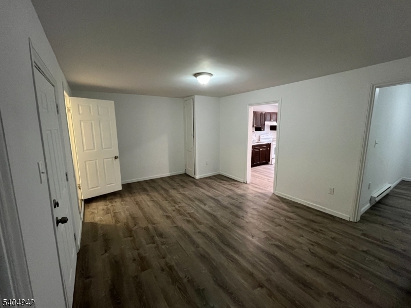 9 Randall Street Phillipsburg, NJ 08865 - Photo 2 of 13 an empty room with wooden floor and windows