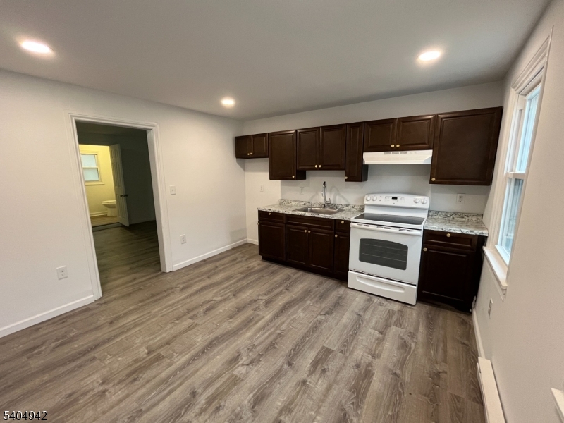 9 Randall Street Phillipsburg, NJ 08865 - Photo 5 of 13 a large kitchen with stainless steel appliances granite countertop a stove and a sink