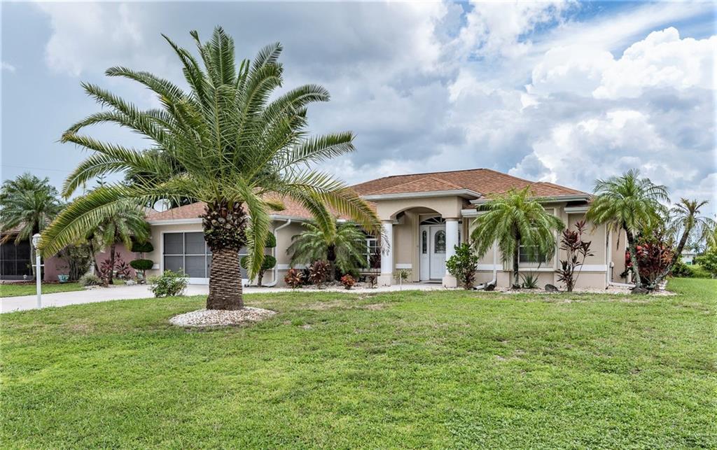 2154 Rio De Janeiro Avenue Punta Gorda, FL 33983 - Photo 1 of 1 a view of a house with a porch and a garden