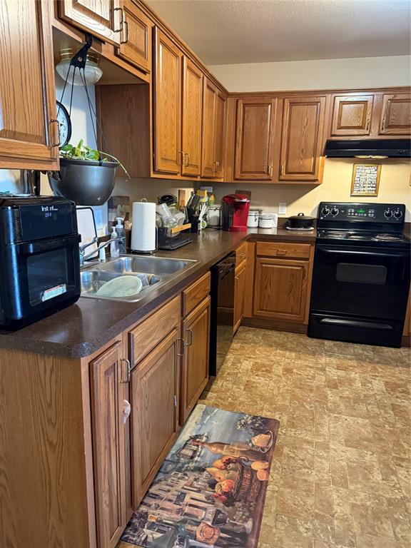 5200 Mountain Spring Trail Fort Worth, TX 76123 - Photo 21 of 23 a kitchen with stainless steel appliances granite countertop a stove sink and cabinets