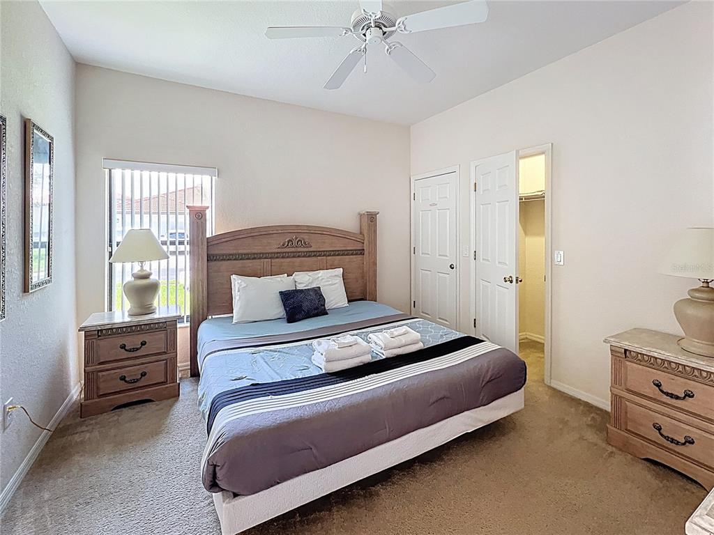102 Sandy Point Way Clermont, FL 34714 - Photo 13 of 33 a bedroom with a bed and a window