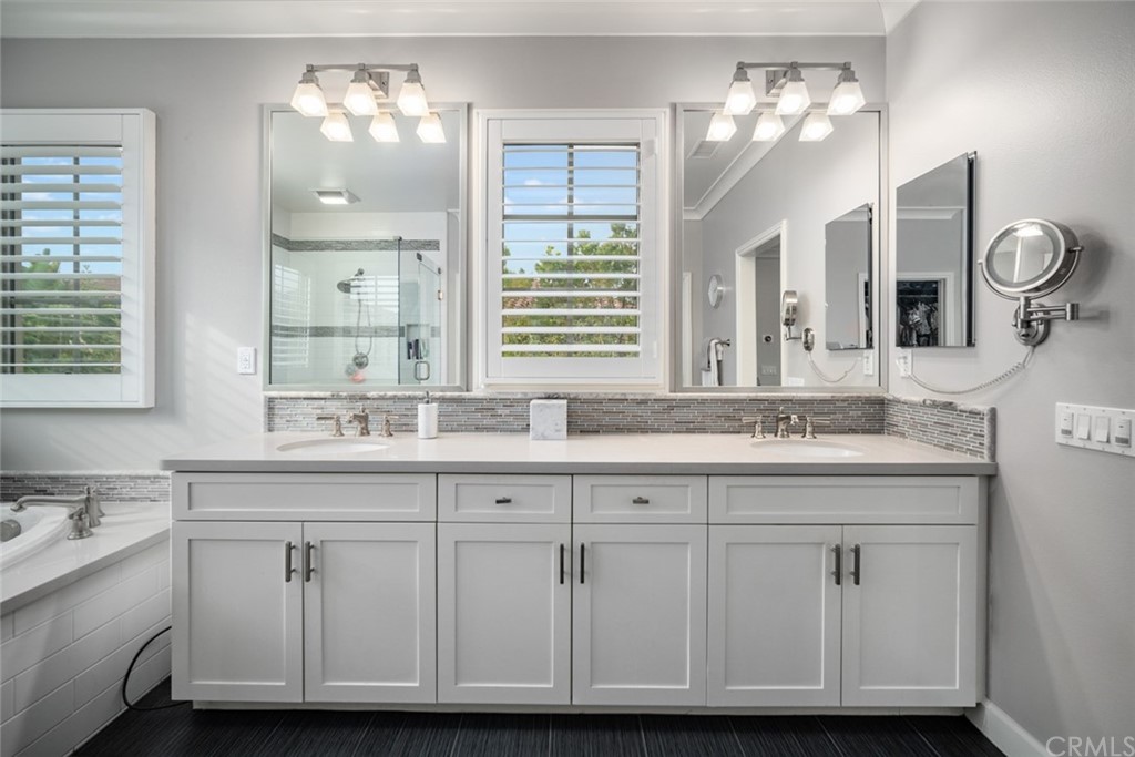 52 Umbria Irvine, CA 92618 - Photo 19 of 50 a bathroom with a sink double vanity and a mirror