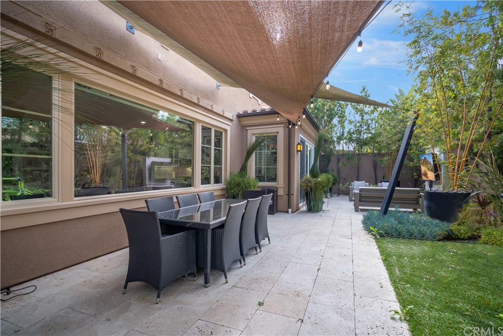 52 Umbria Irvine, CA 92618 - Photo 37 of 50 a view of a patio with a dining table and chairs