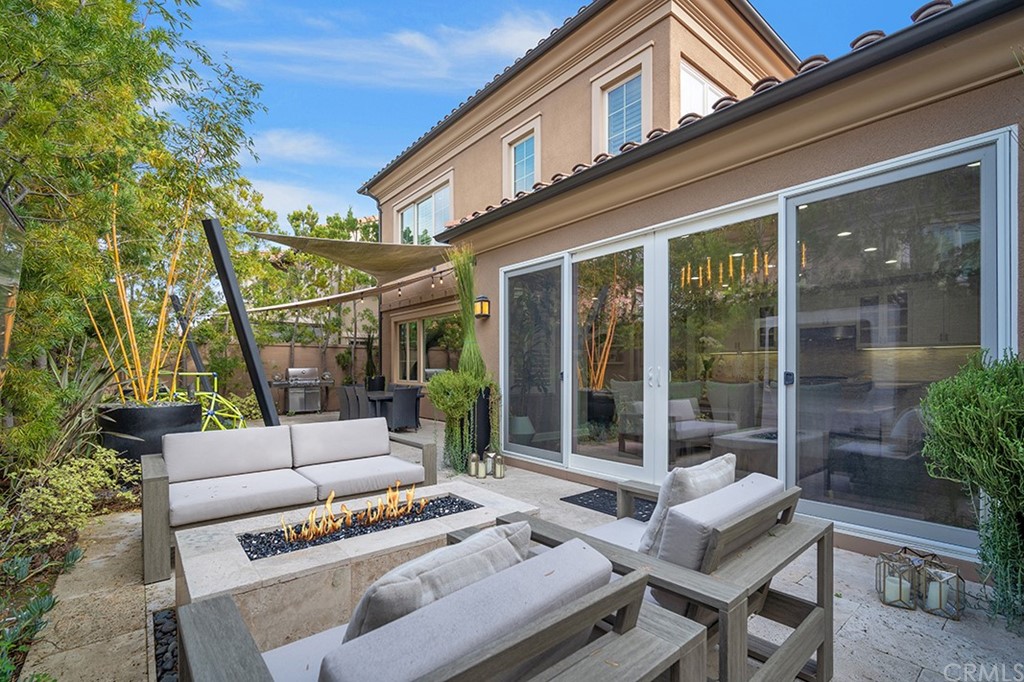 52 Umbria Irvine, CA 92618 - Photo 40 of 50 a view of a patio with couches table and chairs and potted plants