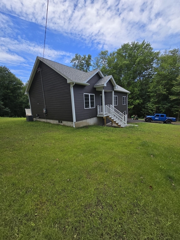 1242 Bemis Road Warren, MA 01083 - Photo 23 of 25 a view of a house with a yard
