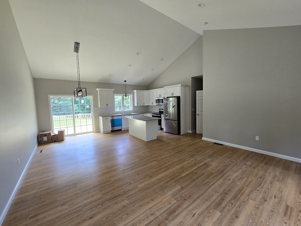 1242 Bemis Road Warren, MA 01083 - Photo 6 of 25 a view of a kitchen with furniture and wooden floor