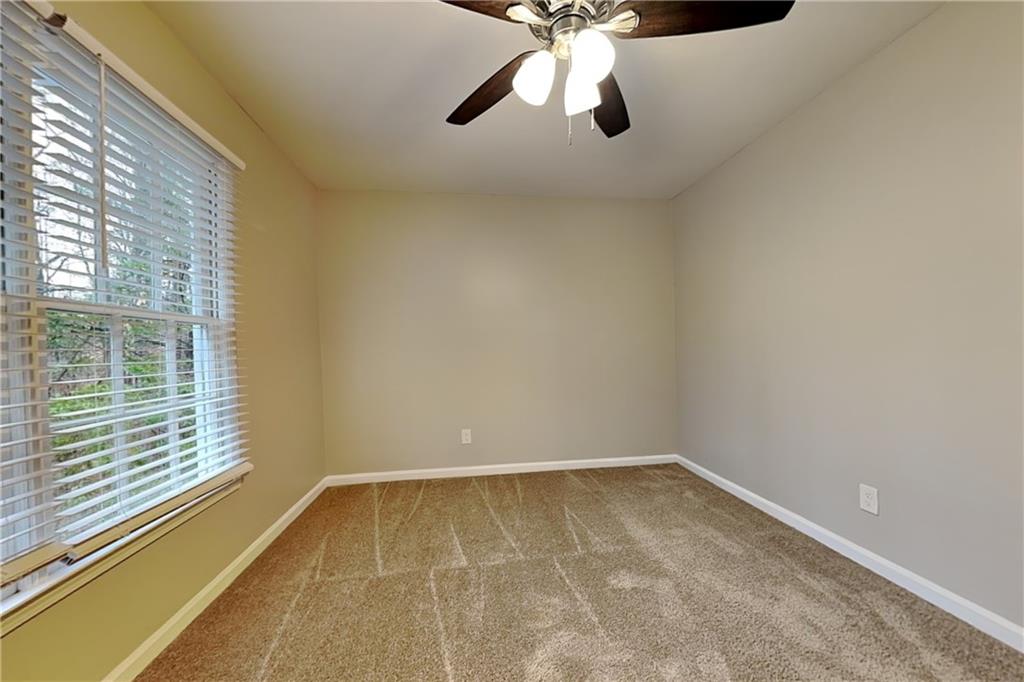 404 Rams Court Tucker, GA 30084 - Photo 14 of 21 a view of an empty room with a window