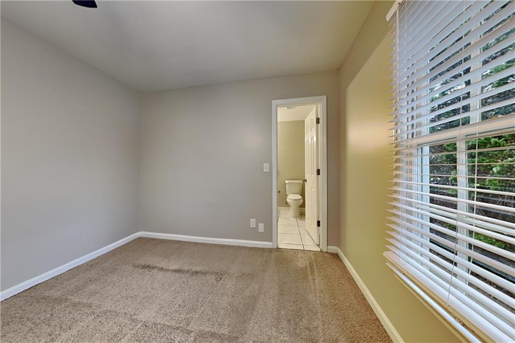 404 Rams Court Tucker, GA 30084 - Photo 15 of 21 a view of an empty room with a window