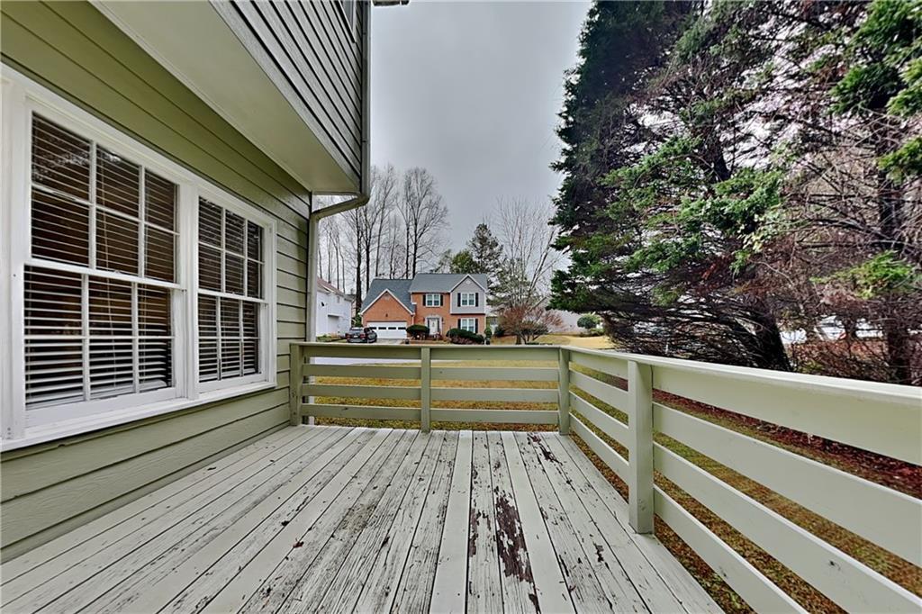 404 Rams Court Tucker, GA 30084 - Photo 18 of 21 a view of balcony with wooden floor and fence