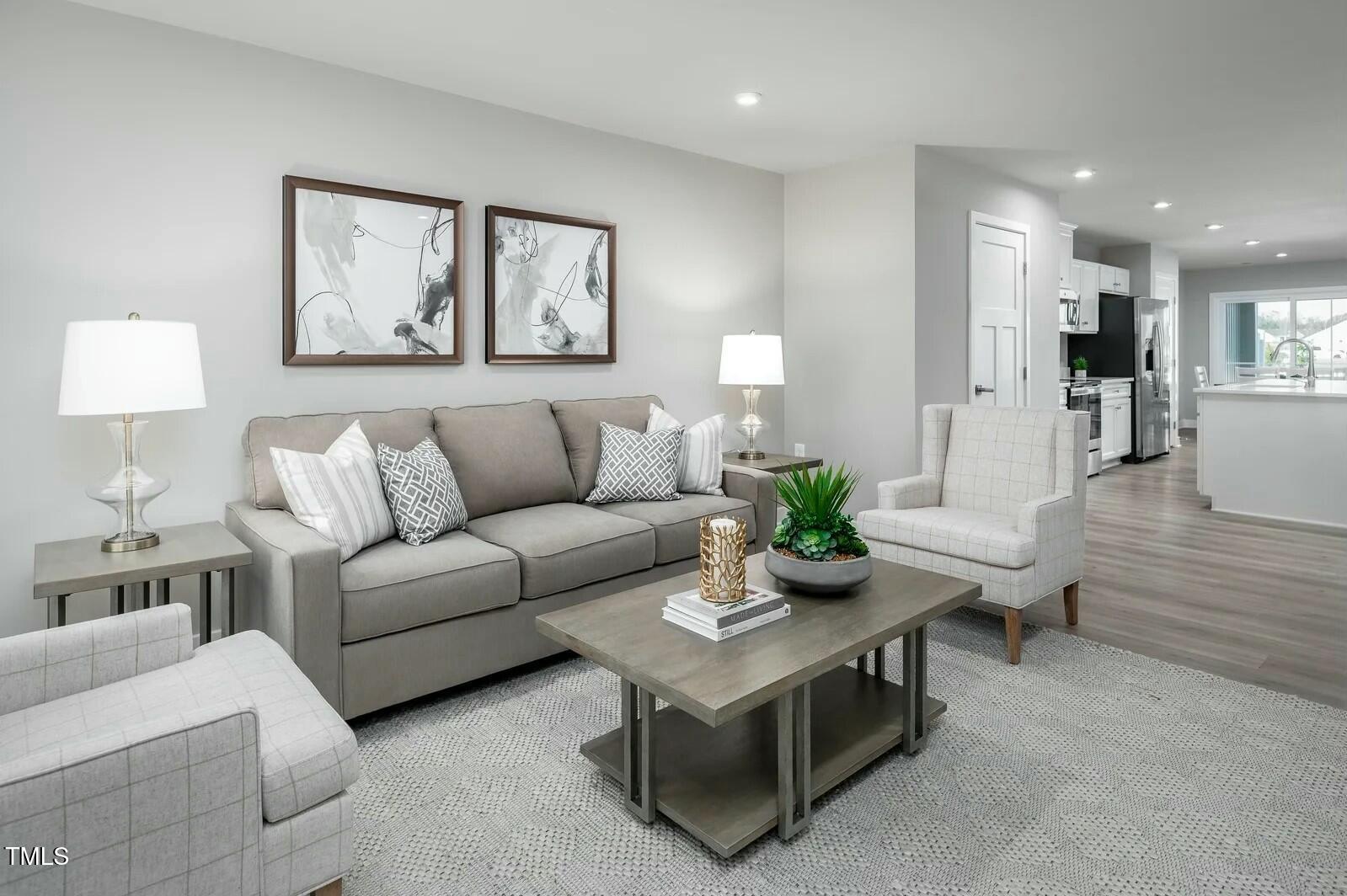 480 Grand Silo Road Raleigh, NC 27603 - Photo 4 of 12 a living room with furniture and a couch