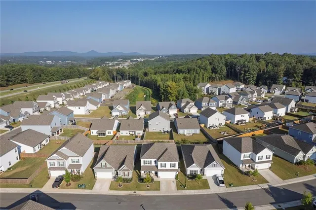 a view of multiple houses with outdoor space