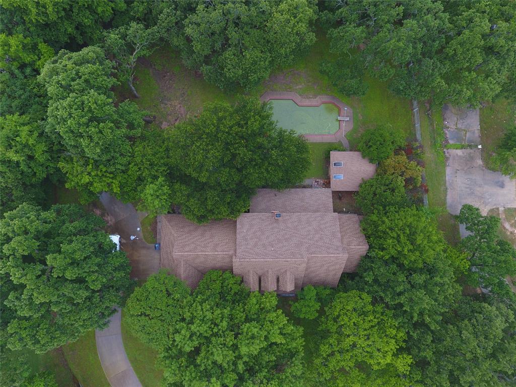 an aerial view of a house with a yard and a yard