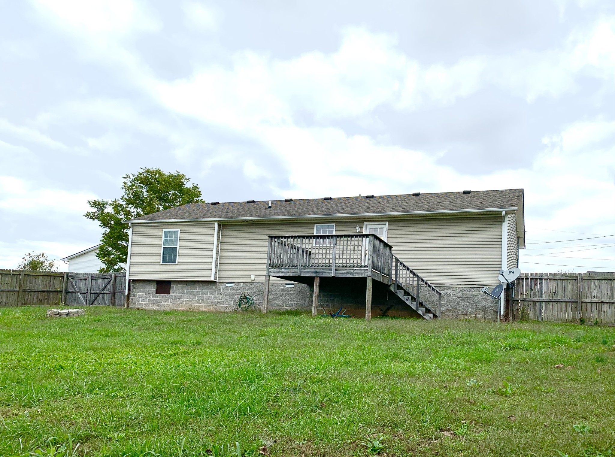 106 Milard Court Oak Grove, KY 42262 - Photo 17 of 17 a backyard of a house with table and chairs