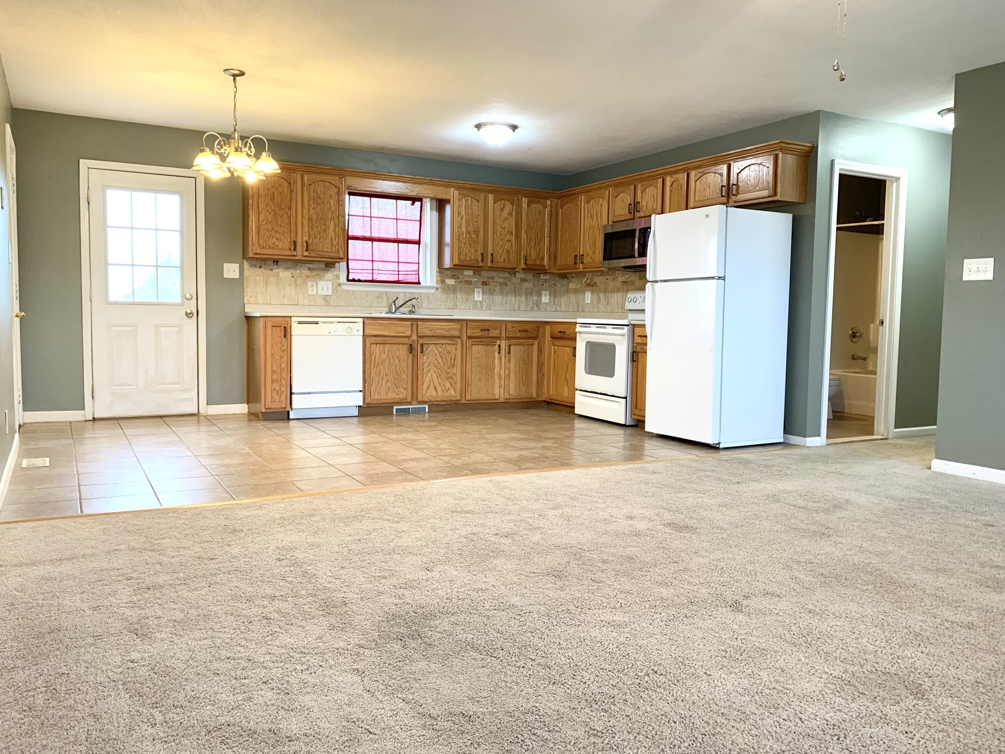 106 Milard Court Oak Grove, KY 42262 - Photo 4 of 17 a view of a kitchen with refrigerator and a dishwasher