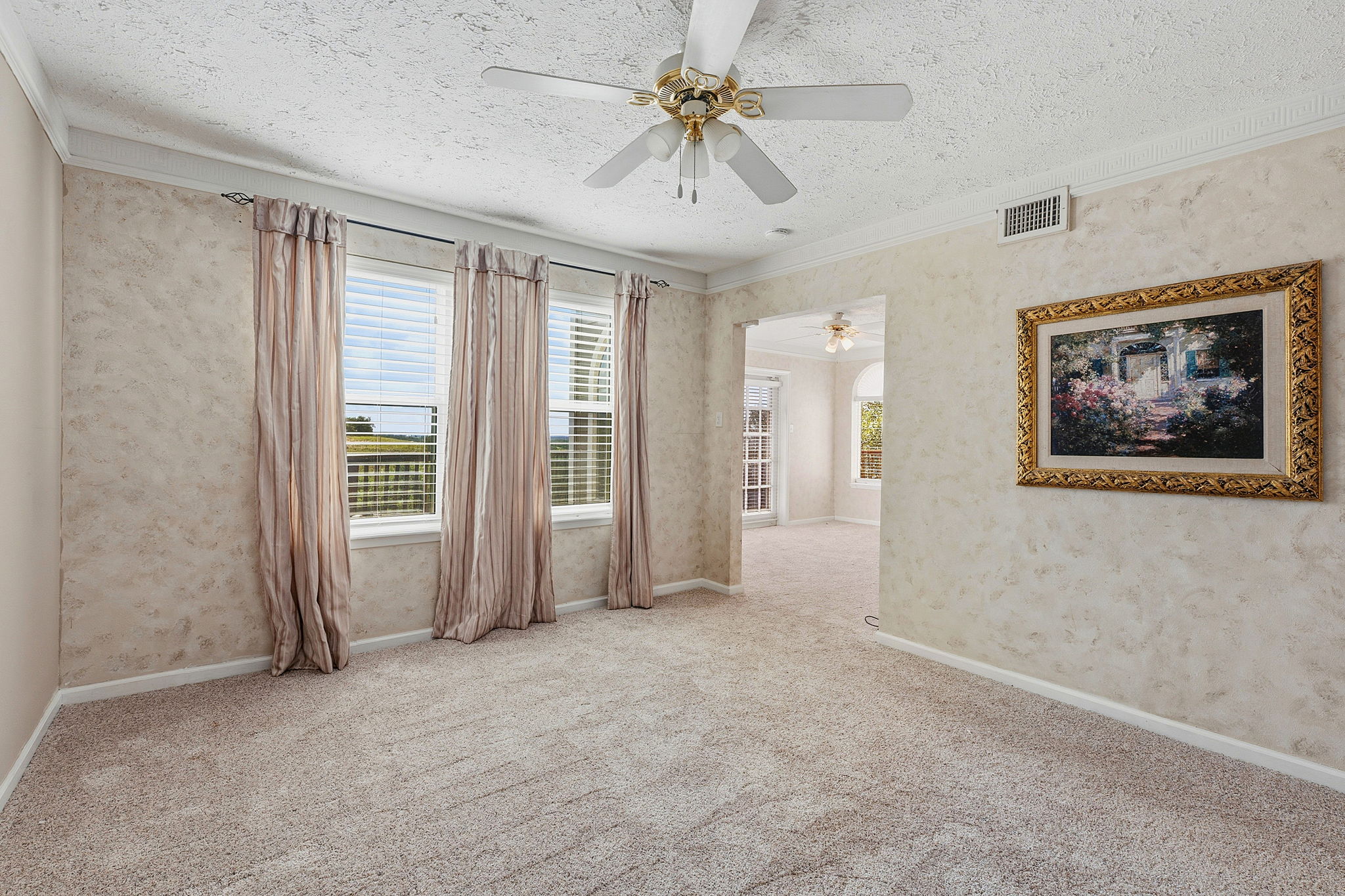 3230 West Fitzhugh Road Dripping Springs, TX 78620 - Photo 16 of 34 A comfortable room boasts plush carpeting and large windows, offering pleasant natural light.