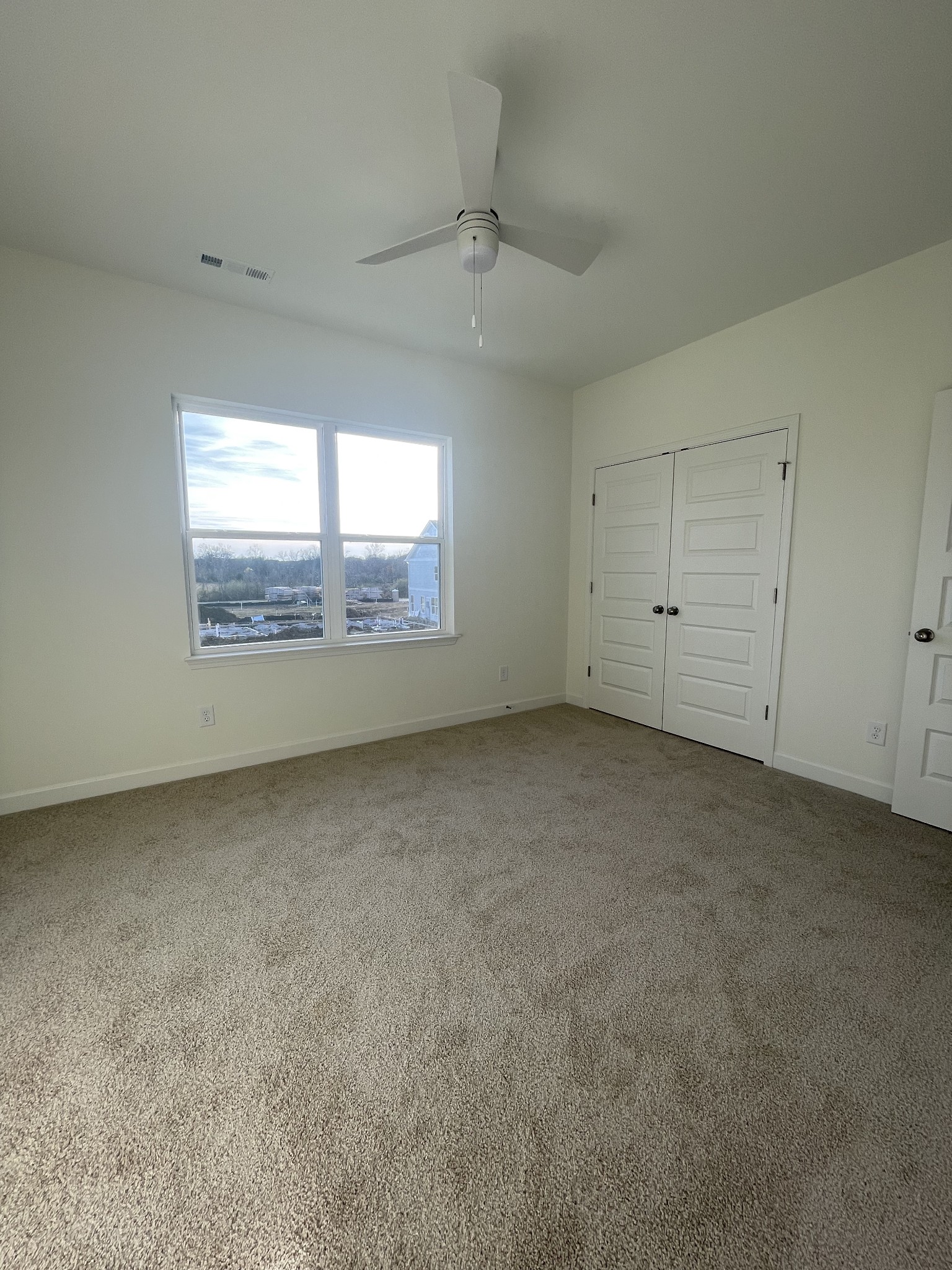153 Bess Boulevard Spring Hill, TN 37174 - Photo 22 of 22 an empty room with a empty space and windows