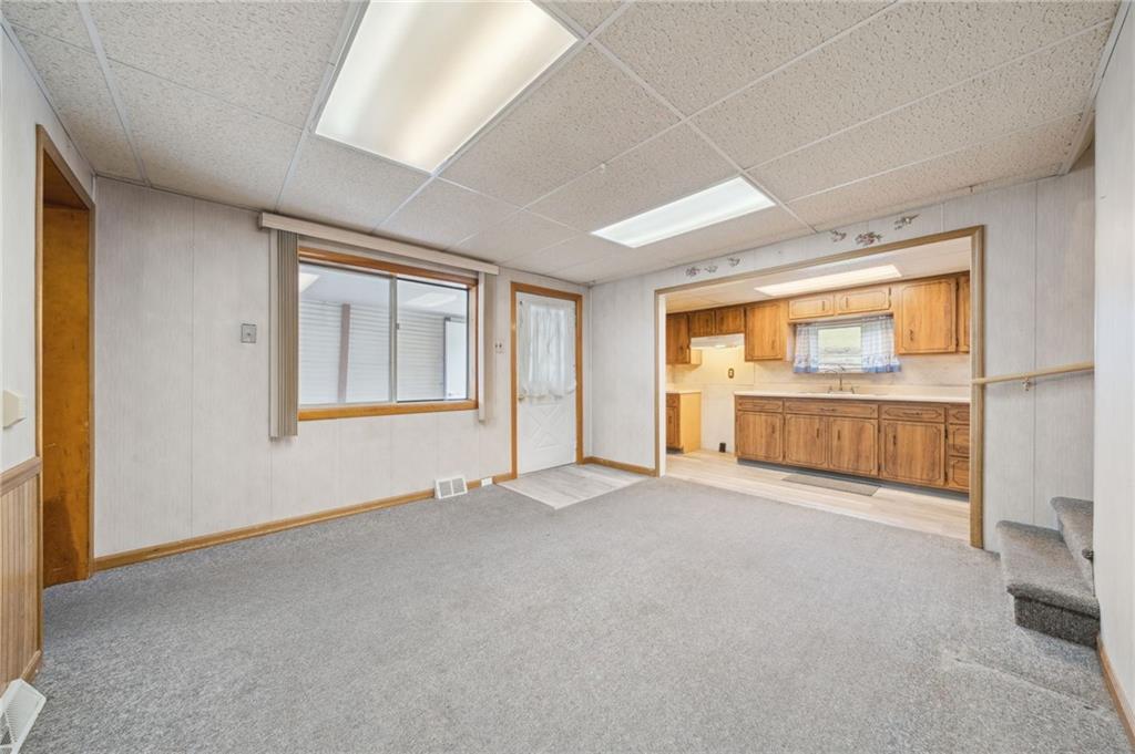 178 Locust Street Muse, PA 15350 - Photo 16 of 28 an empty room with cabinet and windows