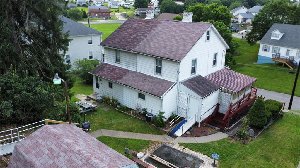 178 Locust Street Muse, PA 15350 - Photo 6 of 28 a aerial view of a house with a yard table and chairs