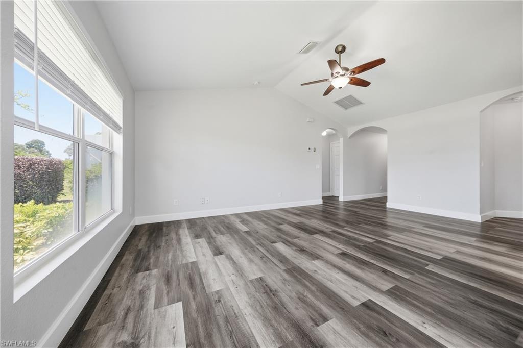 4621 25th Street Southwest Lehigh Acres, FL 33973 - Photo 11 of 41 a view of empty room with wooden floor and fan