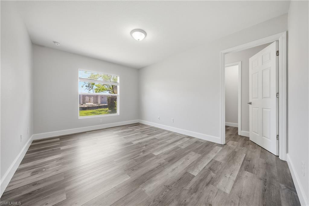 4621 25th Street Southwest Lehigh Acres, FL 33973 - Photo 14 of 41 an empty room with windows and entrance
