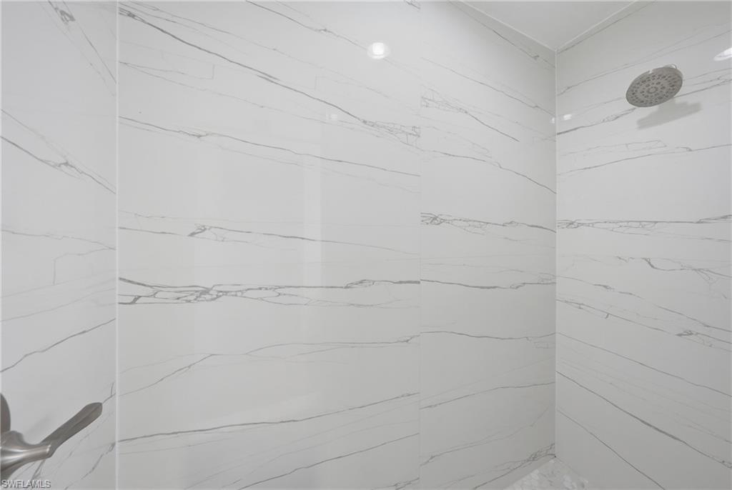 4621 25th Street Southwest Lehigh Acres, FL 33973 - Photo 18 of 41 a bathroom with a shower