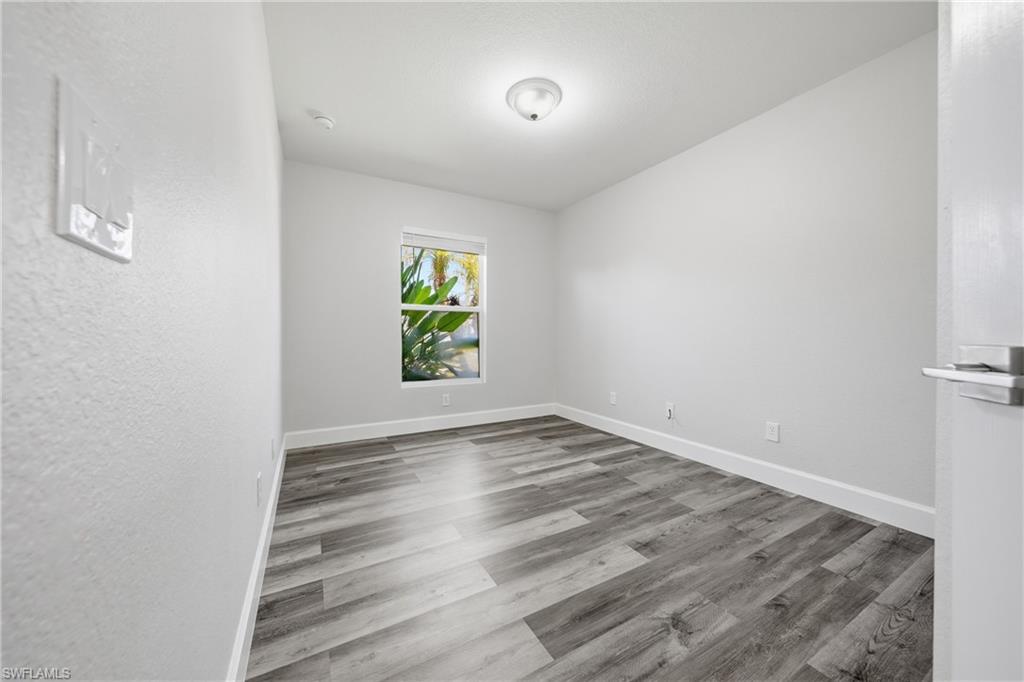 4621 25th Street Southwest Lehigh Acres, FL 33973 - Photo 21 of 41 a view of an empty room and window