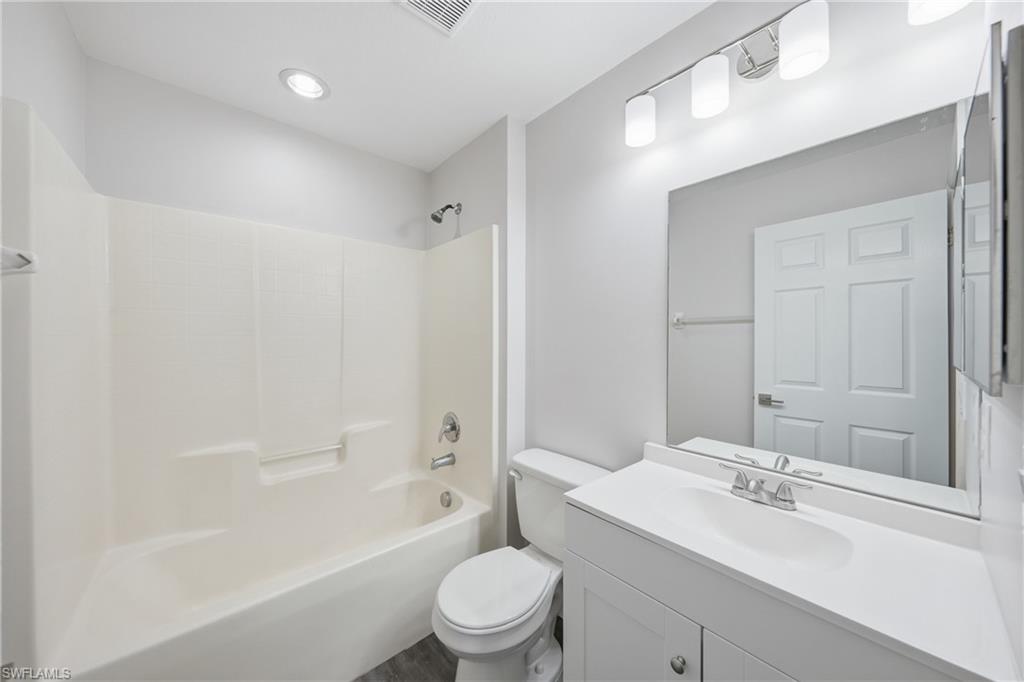 4621 25th Street Southwest Lehigh Acres, FL 33973 - Photo 23 of 41 a bathroom with a sink a toilet and shower