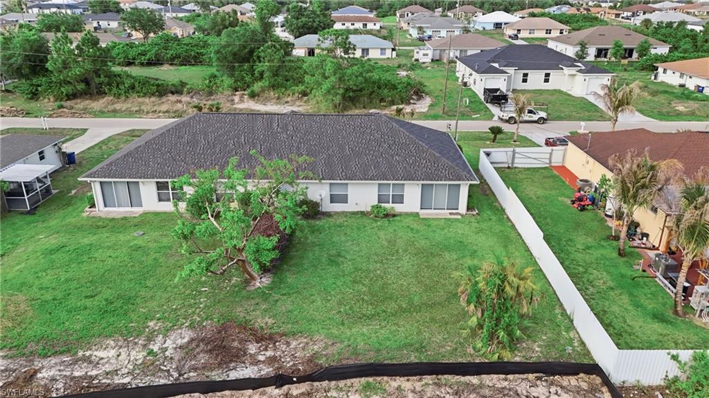 4621 25th Street Southwest Lehigh Acres, FL 33973 - Photo 35 of 41 a aerial view of a house with a yard
