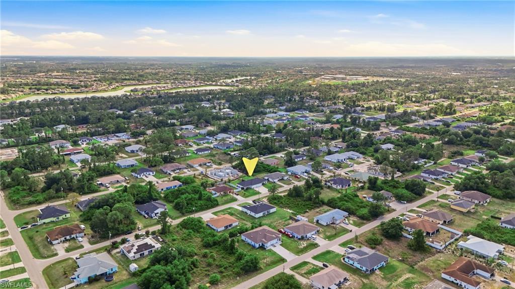 4621 25th Street Southwest Lehigh Acres, FL 33973 - Photo 40 of 41 an aerial view of multiple house
