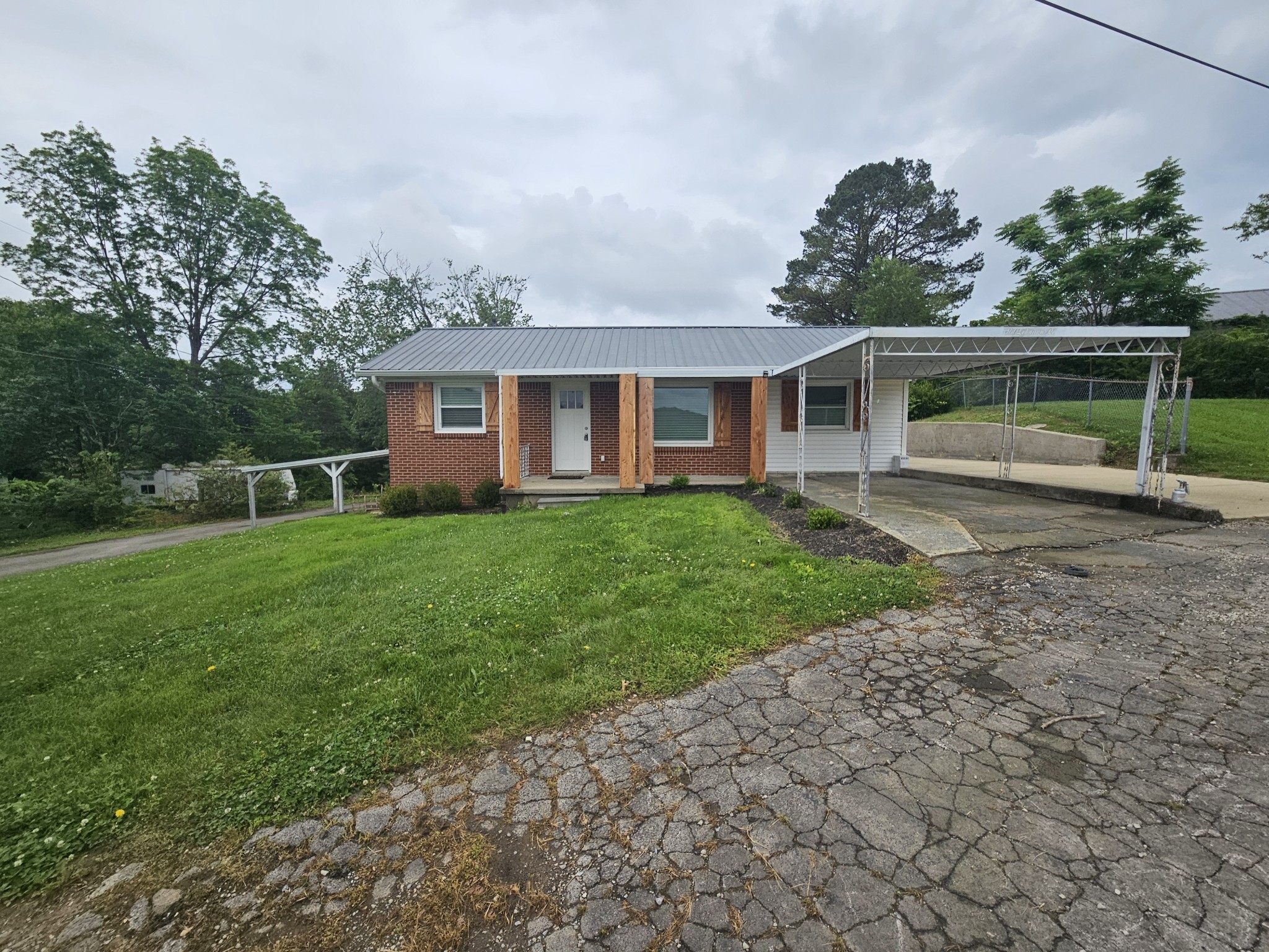 166 Old Lebanon Road Carthage, TN 37030 - Photo 2 of 25 a front view of house with yard and green space