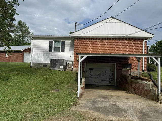 a front view of a house with a garage