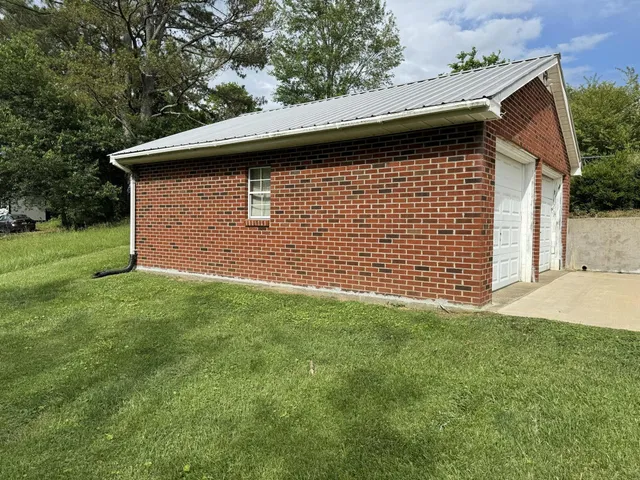 a backyard of a house with lots of green space