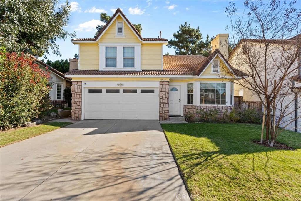 6433 Aleatico Place Rancho Cucamonga, CA 91737 - Photo 1 of 39 a front view of a house with a yard and garage