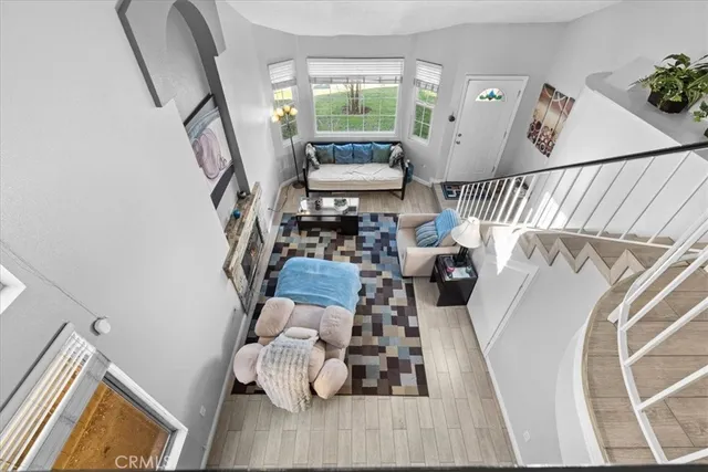 a view of living room with furniture and wooden floor