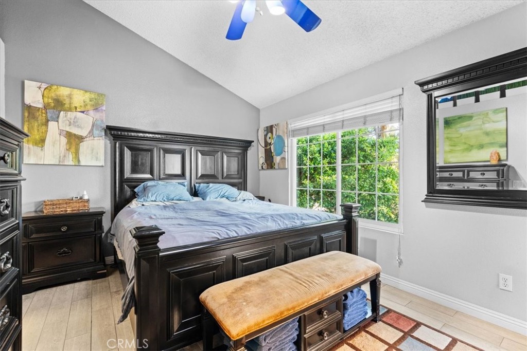 6433 Aleatico Place Rancho Cucamonga, CA 91737 - Photo 17 of 39 a bedroom with a bed window and a dresser