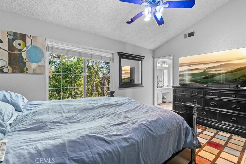 6433 Aleatico Place Rancho Cucamonga, CA 91737 - Photo 19 of 39 a bedroom with a bed and a flat screen tv