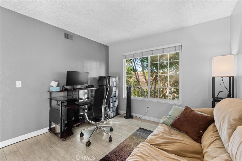6433 Aleatico Place Rancho Cucamonga, CA 91737 - Photo 20 of 39 a view of a livingroom with workspace and a window