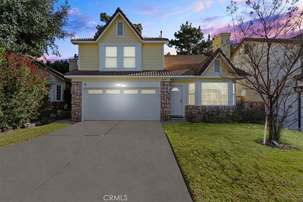 6433 Aleatico Place Rancho Cucamonga, CA 91737 - Photo 2 of 39 a front view of a house with a yard and garage