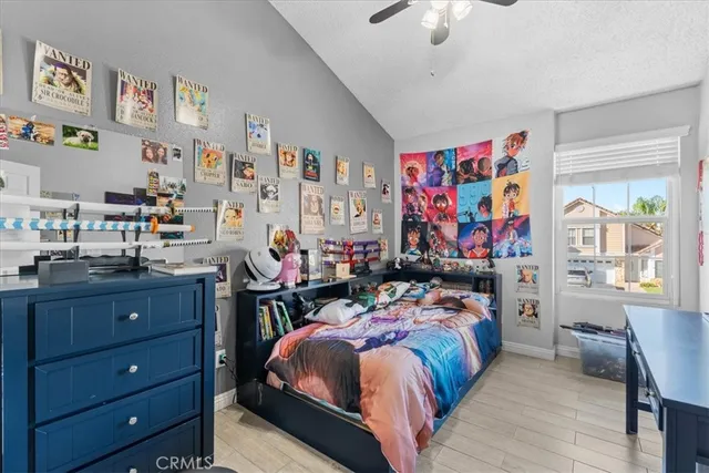 a bed room with a bed and a desk