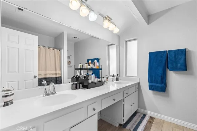 a kitchen with a sink cabinets and window