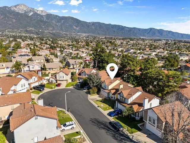an aerial view of a house with a swimming pool
