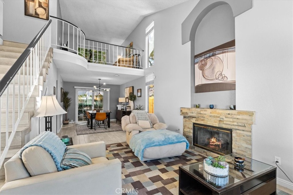 6433 Aleatico Place Rancho Cucamonga, CA 91737 - Photo 5 of 39 a living room with furniture and a fireplace