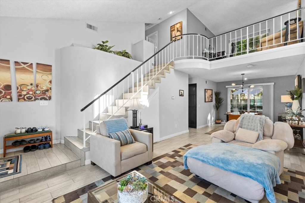 6433 Aleatico Place Rancho Cucamonga, CA 91737 - Photo 6 of 39 a living room with furniture and wooden floor