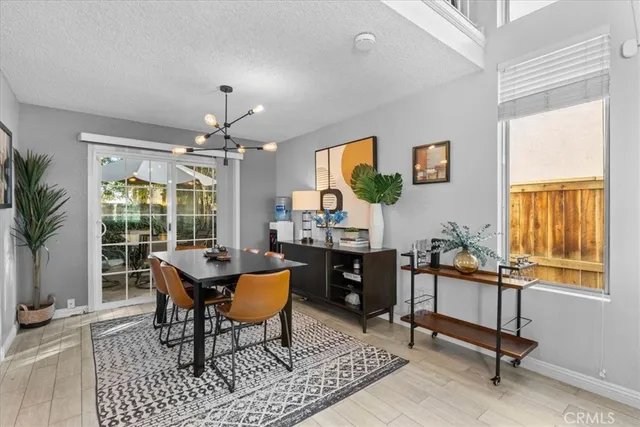 a workspace with wooden floor and a window
