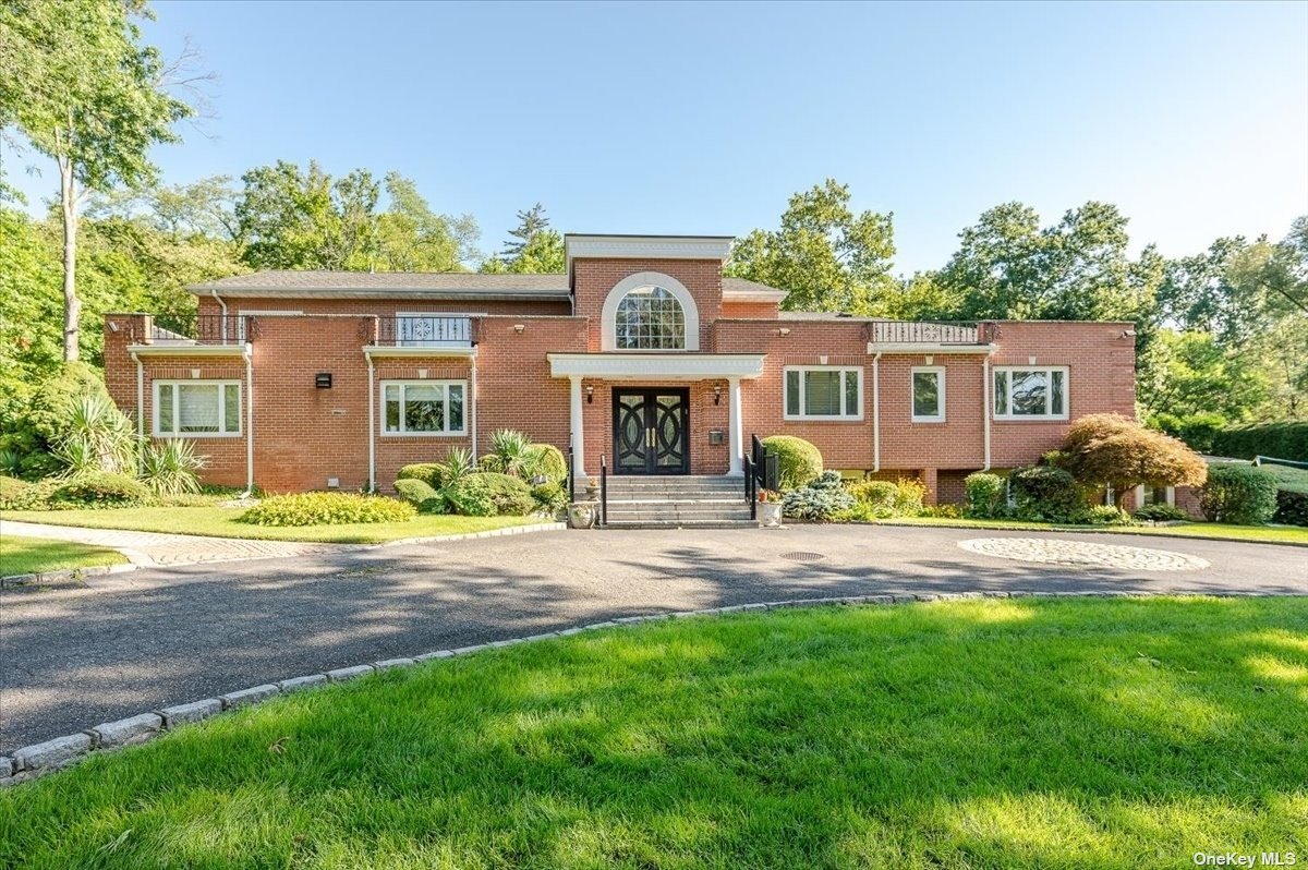 4 Sinclair Drive Great Neck, NY 11024 - Photo 1 of 1 front view of a house with a yard