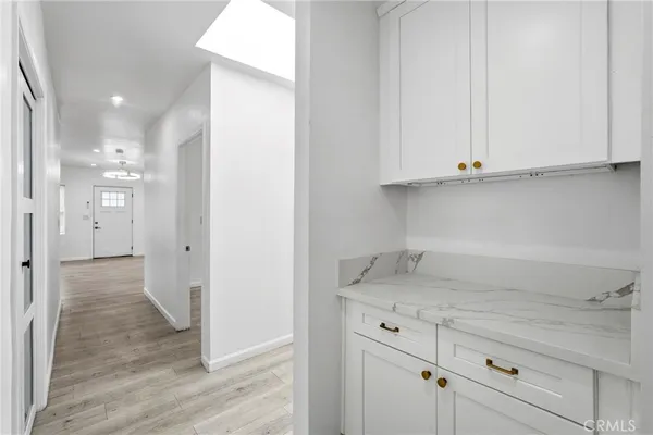 a view of cabinets and wooden floor
